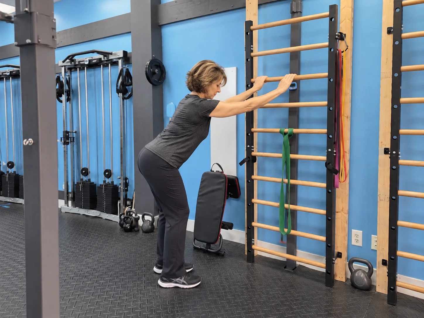 AI illustration of a woman stretching at wooden stall bars in Optimal Fitness